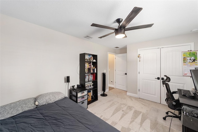 7442 SW 129th Ln, Ocala, FL 34473 - bedroom featuring light carpet, baseboards, ceiling fan, an office area, and a closet