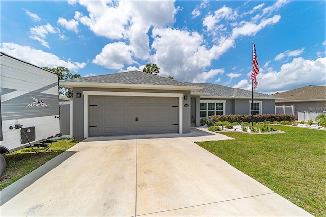 7442 SW 129th Ln, Ocala, FL 34473 - single story home featuring stucco siding, concrete driveway, a front lawn, and an attached garage