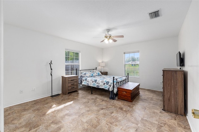 30 Bahia Trace Loop, Ocala, FL 34472 - bedroom featuring multiple windows, a ceiling fan, and baseboards