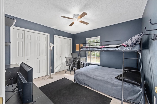 30 Bahia Trace Loop, Ocala, FL 34472 - bedroom featuring two closets, a textured ceiling, a ceiling fan, and carpet