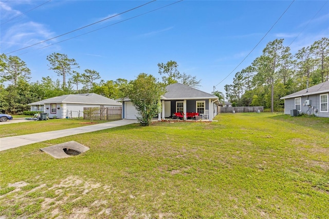 30 Bahia Trace Loop, Ocala, FL 34472 - ranch-style house with concrete driveway, covered porch, central air condition unit, and an attached garage