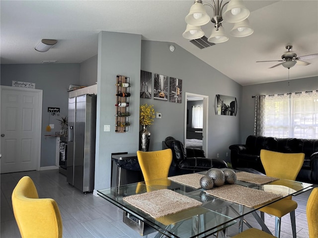 1100 NW 126th Ln, Citra, FL 32113 - dining room featuring lofted ceiling, a chandelier, a ceiling fan, and baseboards