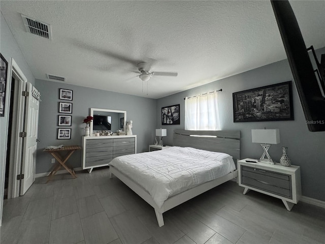 1100 NW 126th Ln, Citra, FL 32113 - bedroom featuring a textured ceiling, baseboards, and ceiling fan
