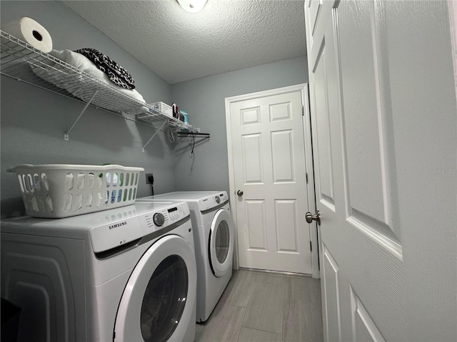 1100 NW 126th Ln, Citra, FL 32113 - washroom featuring independent washer and dryer and a textured ceiling