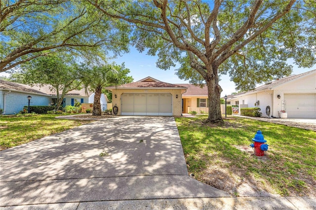 9266 SW 91st Cir, Ocala, FL 34481 - single story home with a garage, concrete driveway, brick siding, and a front yard