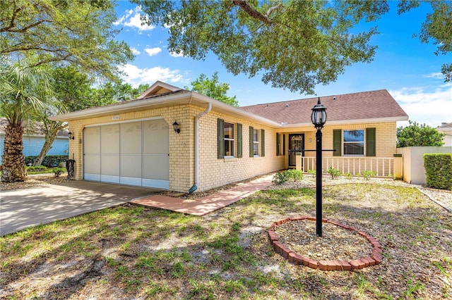 9266 SW 91st Cir, Ocala, FL 34481 - ranch-style home with brick siding, a garage, and driveway