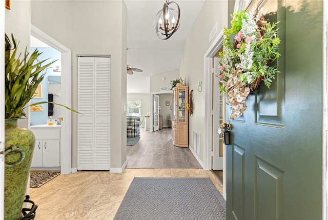 9266 SW 91st Cir, Ocala, FL 34481 - entryway with a chandelier and baseboards