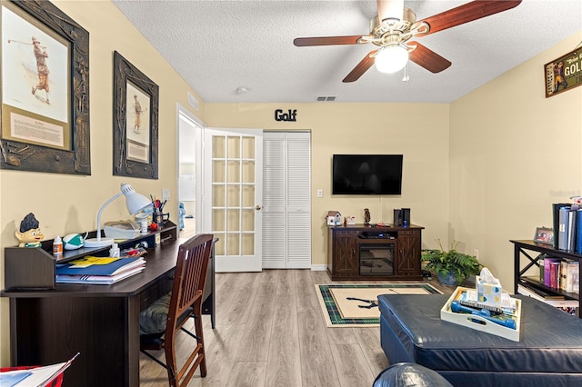9266 SW 91st Cir, Ocala, FL 34481 - living room featuring wood finished floors, an office area, ceiling fan, and a textured ceiling