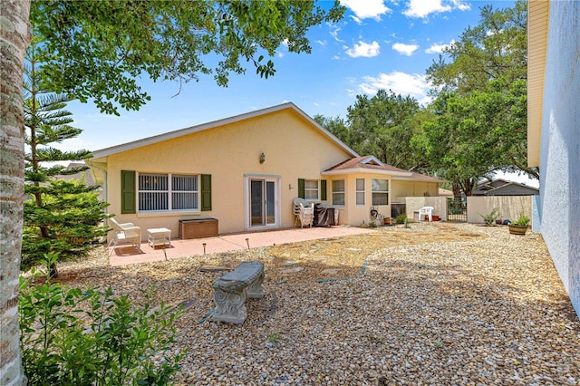 9266 SW 91st Cir, Ocala, FL 34481 - back of property featuring stucco siding and a patio area