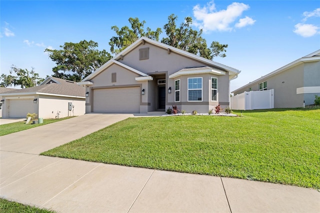 181 NW 45th Loop, Ocala, FL 34475 - view of front of house featuring an attached garage, stucco siding, and concrete driveway