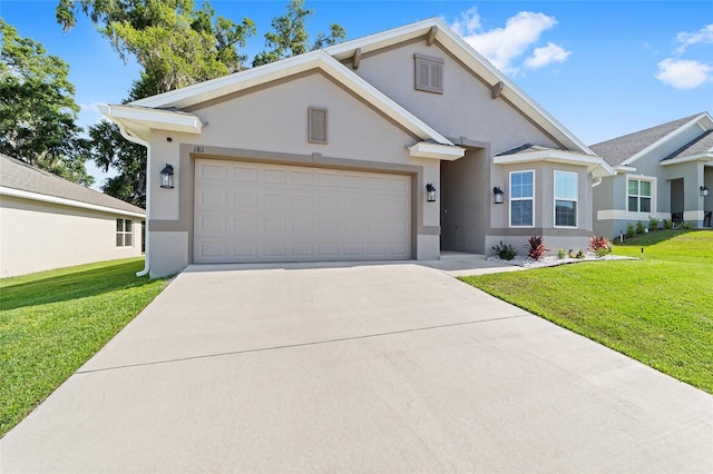 181 NW 45th Loop, Ocala, FL 34475 - view of front of home featuring stucco siding, concrete driveway, a garage, and a front yard