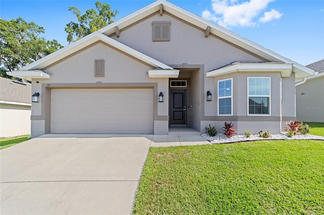 181 NW 45th Loop, Ocala, FL 34475 - view of front of house with stucco siding, driveway, a front lawn, and an attached garage