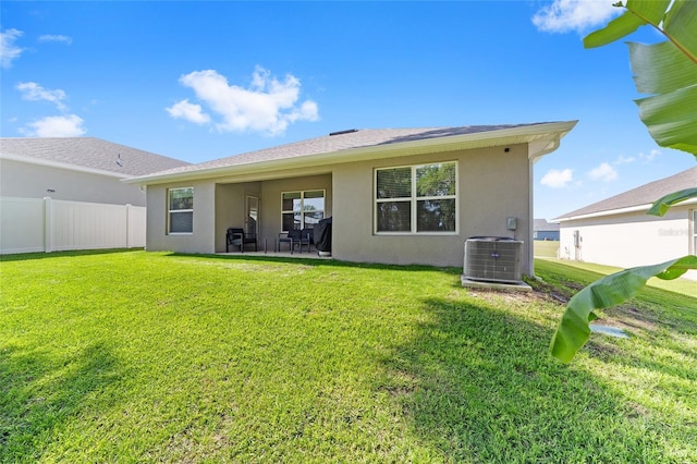 181 NW 45th Loop, Ocala, FL 34475 - back of house featuring central air condition unit, stucco siding, and a patio