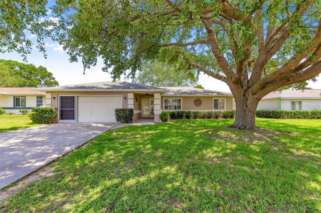 10016 SW 62nd Cir, Ocala, FL 34476 - ranch-style home with an attached garage, concrete driveway, and a front yard