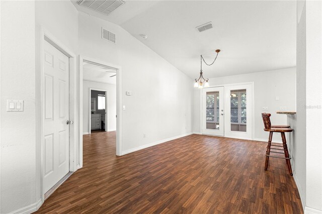 10016 SW 62nd Cir, Ocala, FL 34476 - empty room featuring vaulted ceiling, dark wood-type flooring, a chandelier, french doors, and baseboards