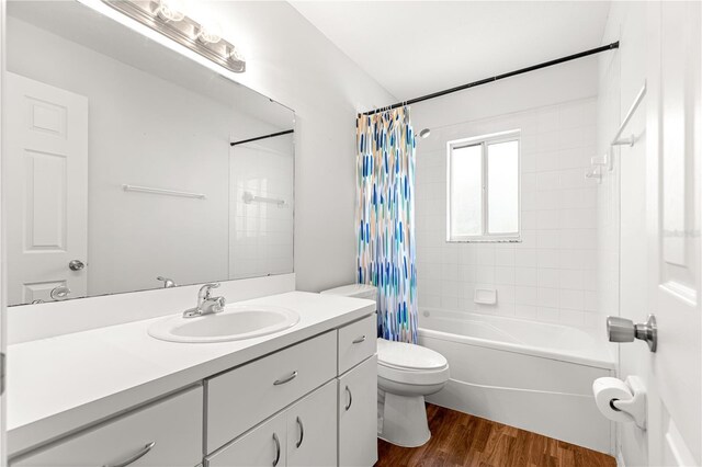 10016 SW 62nd Cir, Ocala, FL 34476 - full bathroom featuring vanity, shower / bath combination with curtain, toilet, and wood finished floors