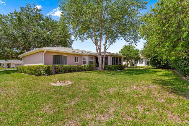 10016 SW 62nd Cir, Ocala, FL 34476 - view of front of property with a front yard and stucco siding