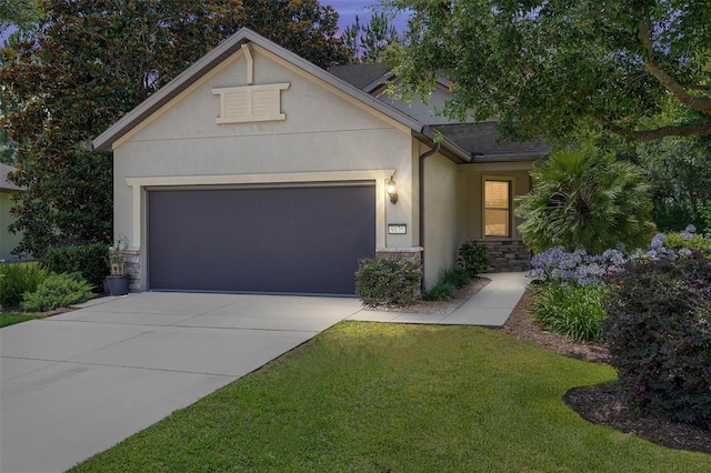 9170 SW 65th Loop, Ocala, FL 34481 - traditional-style house featuring stucco siding, stone siding, an attached garage, and driveway