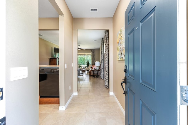 9170 SW 65th Loop, Ocala, FL 34481 - foyer with light tile patterned flooring, baseboards, and ceiling fan