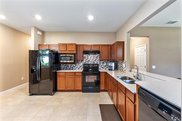 9170 SW 65th Loop, Ocala, FL 34481 - kitchen with black appliances, a sink, under cabinet range hood, backsplash, and light countertops