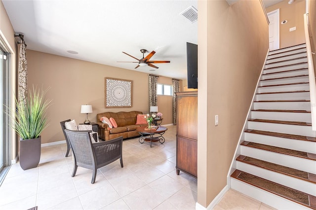 9170 SW 65th Loop, Ocala, FL 34481 - living area featuring ceiling fan, stairway, baseboards, and light tile patterned floors