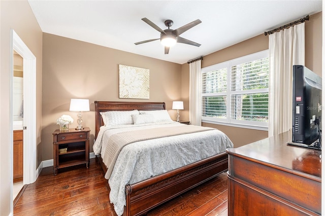 9170 SW 65th Loop, Ocala, FL 34481 - bedroom with dark wood-style flooring, baseboards, and a ceiling fan