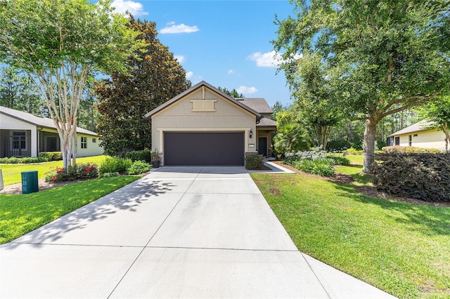 9170 SW 65th Loop, Ocala, FL 34481 - view of front of home featuring concrete driveway, a front yard, a garage, and stucco siding