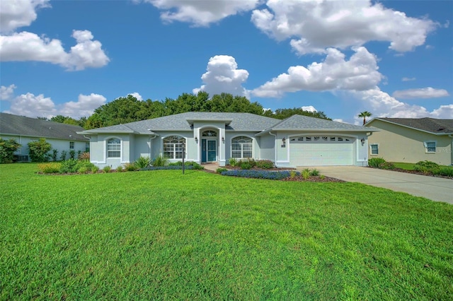 11147 SW 53rd Cir, Ocala, FL 34476 - ranch-style home featuring an attached garage, concrete driveway, a front yard, and stucco siding