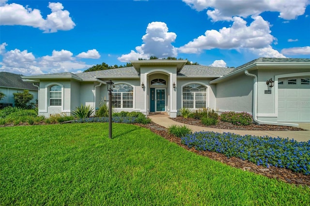 11147 SW 53rd Cir, Ocala, FL 34476 - single story home with stucco siding, an attached garage, and a front lawn