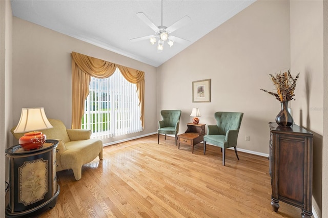 11147 SW 53rd Cir, Ocala, FL 34476 - living area featuring light wood-type flooring, vaulted ceiling, ceiling fan, and baseboards