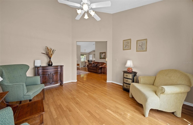 11147 SW 53rd Cir, Ocala, FL 34476 - living area with ceiling fan, light wood-style flooring, and baseboards