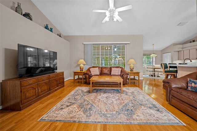 11147 SW 53rd Cir, Ocala, FL 34476 - living area with lofted ceiling, ceiling fan, light wood-style flooring, and baseboards