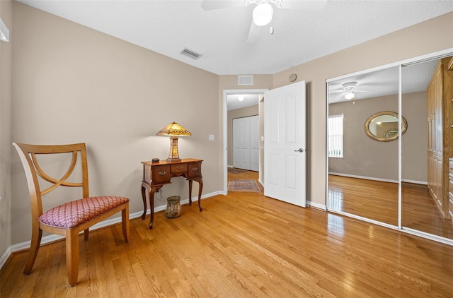 11147 SW 53rd Cir, Ocala, FL 34476 - living area featuring ceiling fan, light wood-style floors, and baseboards