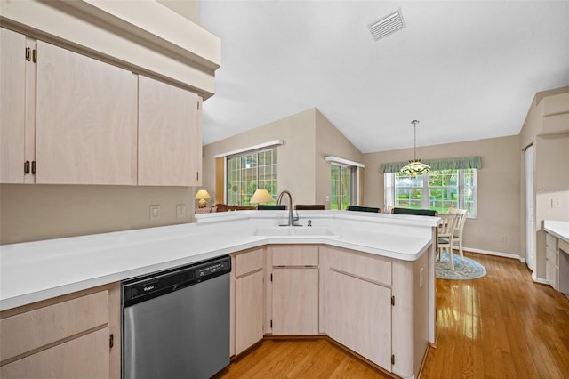 11147 SW 53rd Cir, Ocala, FL 34476 - kitchen featuring stainless steel dishwasher, a sink, a peninsula, light brown cabinets, and light countertops