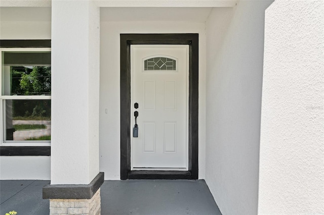 8293 SE 158th St, Summerfield, FL 34491 - view of exterior entry with stucco siding