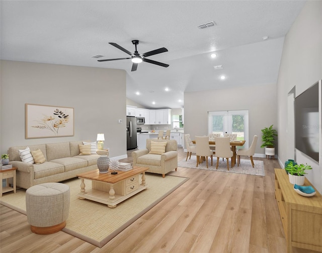 8293 SE 158th St, Summerfield, FL 34491 - living room featuring lofted ceiling, light wood-style flooring, a ceiling fan, baseboards, and recessed lighting