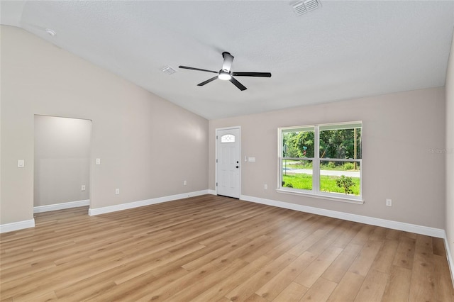 8293 SE 158th St, Summerfield, FL 34491 - unfurnished living room featuring lofted ceiling, ceiling fan, light wood finished floors, and baseboards