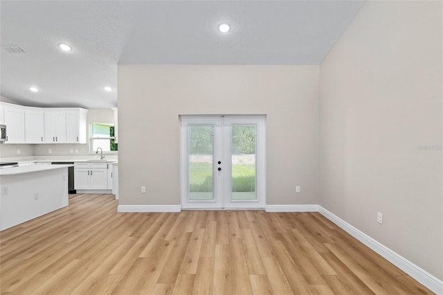8293 SE 158th St, Summerfield, FL 34491 - kitchen featuring a sink, light countertops, dishwashing machine, white cabinets, and baseboards