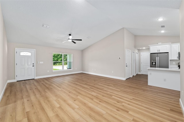 8293 SE 158th St, Summerfield, FL 34491 - unfurnished living room featuring lofted ceiling, ceiling fan, light wood-style floors, baseboards, and recessed lighting