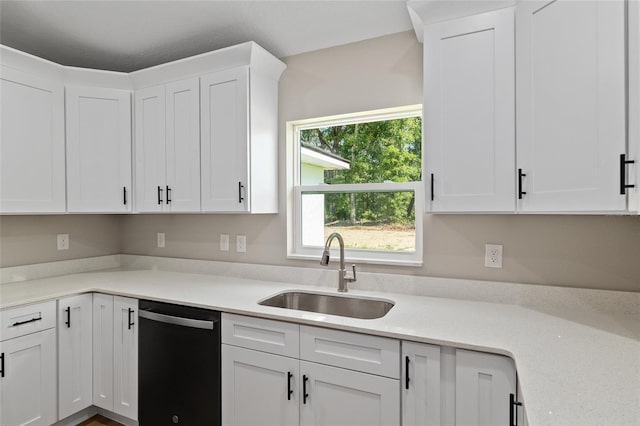 8293 SE 158th St, Summerfield, FL 34491 - kitchen with dishwashing machine, a sink, white cabinetry, and light countertops