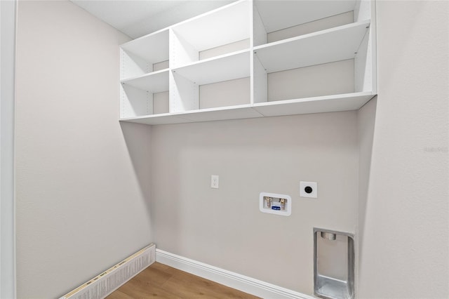 8293 SE 158th St, Summerfield, FL 34491 - laundry room with electric dryer hookup, hookup for a washing machine, baseboards, and wood finished floors