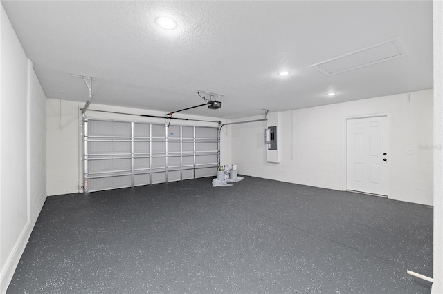 8293 SE 158th St, Summerfield, FL 34491 - garage with a garage door opener, electric panel, and recessed lighting
