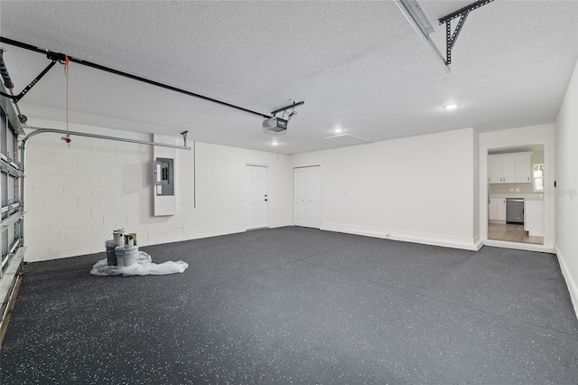 8293 SE 158th St, Summerfield, FL 34491 - garage featuring electric panel, a garage door opener, concrete block wall, and baseboards