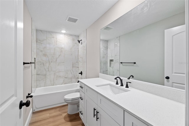8293 SE 158th St, Summerfield, FL 34491 - full bathroom featuring vanity, toilet, wood finished floors, and shower / bathtub combination