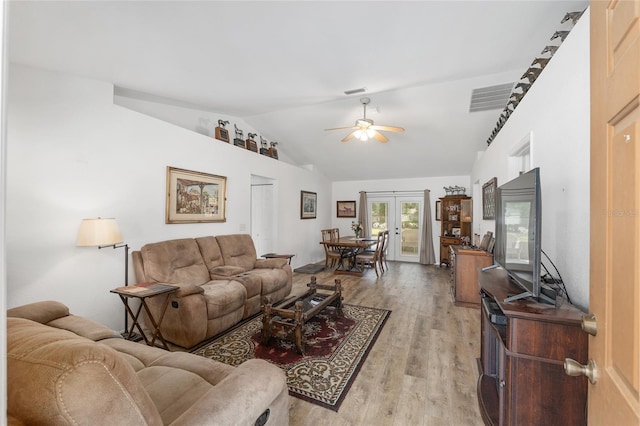 1601 NE 47th Ct, Ocala, FL 34470 - living room featuring lofted ceiling, light wood-style floors, a ceiling fan, and french doors