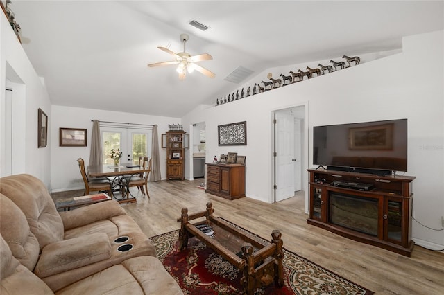 1601 NE 47th Ct, Ocala, FL 34470 - living area featuring ceiling fan, lofted ceiling, wood finished floors, french doors, and baseboards