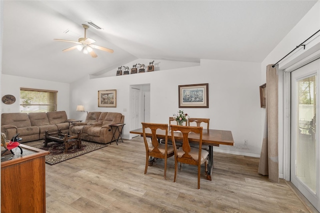 1601 NE 47th Ct, Ocala, FL 34470 - dining area featuring lofted ceiling, a ceiling fan, plenty of natural light, and light wood-style flooring
