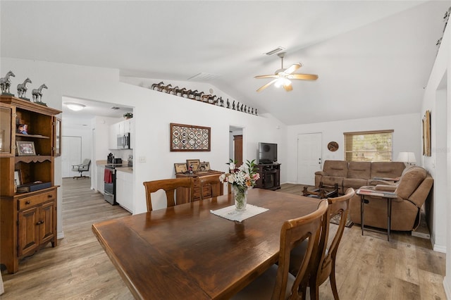 1601 NE 47th Ct, Ocala, FL 34470 - dining area featuring ceiling fan, lofted ceiling, and light wood-style flooring