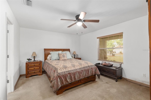 1601 NE 47th Ct, Ocala, FL 34470 - bedroom with light carpet, baseboards, and ceiling fan