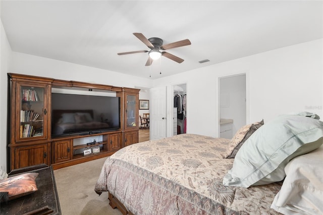 1601 NE 47th Ct, Ocala, FL 34470 - carpeted bedroom featuring a spacious closet, a closet, and ceiling fan